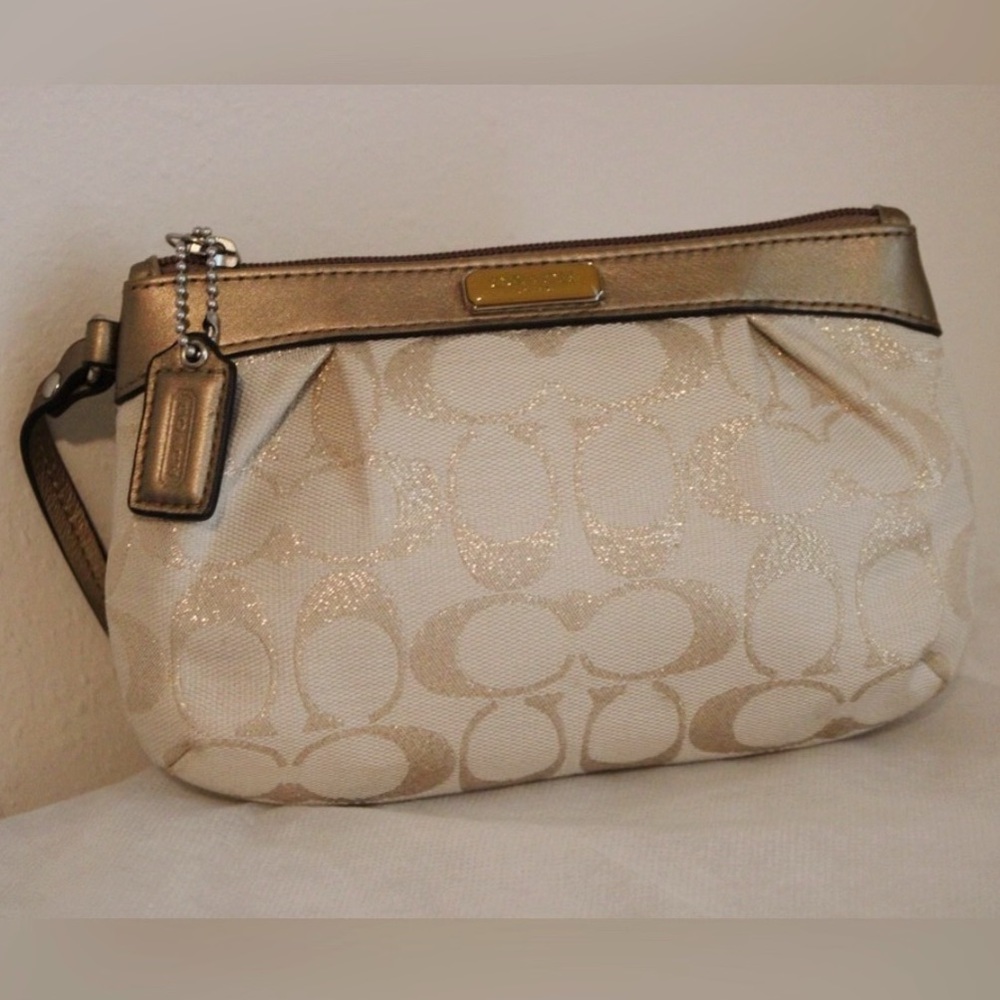 Cream Coach Wristlet with Coach Tag